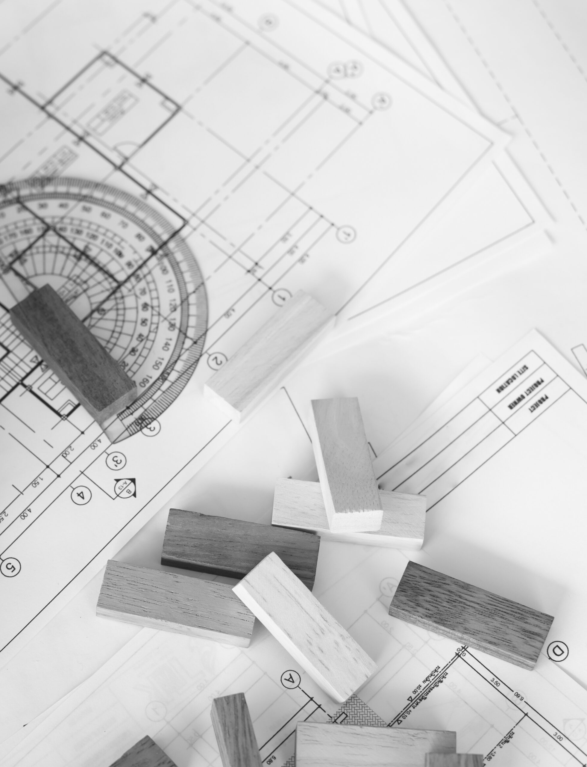 Building blocks on blueprint with rulers